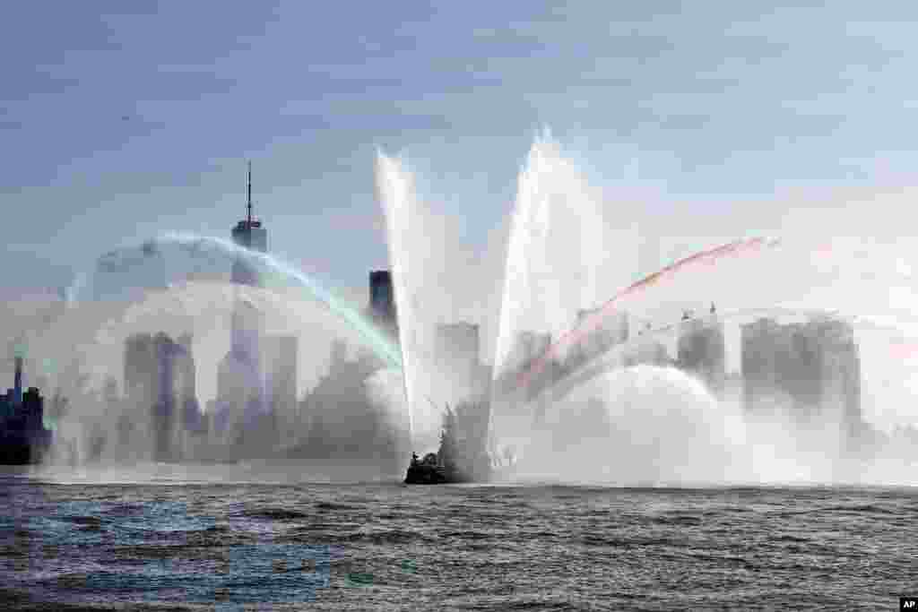 The Fire Department of New York &quot;Firefighter II&quot; sprays water while participating in Fleet Week New York, in New York harbor.