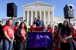 Texas Attorney General Ken Paxton speaks to a crowd of anti-abortion supporters outside the U.S. Supreme Court following arguments over a challenge to a Texas law that bans abortion after six weeks in Washington, November 1, 2021.