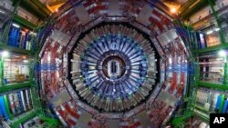 FILE - Researchers at the CERN physics lab near Geneva, used the $5.5 billion atom smasher, called the Large Hadron Collider, to confirm the existence of the Higgs boson particle.