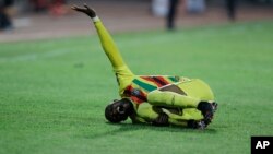 Zimbabwe's Ishmael Wadi gestures following an injury during the African Cup of Nations 2022 group B soccer match between Malawi and Zimbabwe at the Omnisport Stadium in Bafoussam, Cameroon, Friday, Jan. 14, 2022. (AP Photo/Sunday Alamba)
