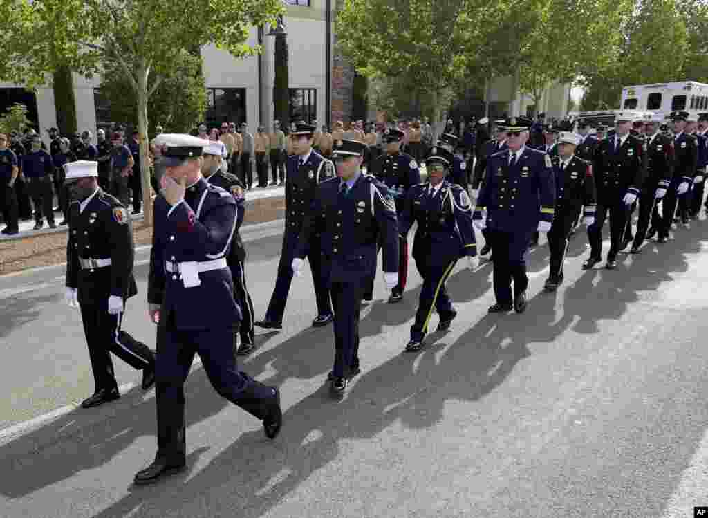 Firefighters from around the country walk in formation outside Tim&#39;s Toyota Center, July 9, 2013, in Prescott, Arizona.&nbsp;