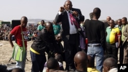 Mosiuoa Lekota, leader for Congress of the People (COPE) addresses mine workers at the Lonmin mine near Rustenburg, South Africa, Monday, Aug. 20, 2012. 