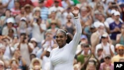 Serena Williams of the United States celebrates winning her women's singles match against Russia's Evgeniya Rodina, on day seven of the Wimbledon Tennis Championships, in London, Monday July 9, 2018. (AP Photo/Tim Ireland)