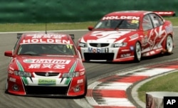 New Zealand's Steven Richards, 11, and Australian Todd Kelly, 22, during the Race 2 of V8 Supercars Shanghai Round, June 12, 2005 at Shanghai International Circuit in Shanghai, China. Mark Skaife of Holden racing Team finished the first place, Richards in second and Kelly in third.