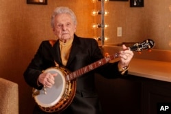 FILE - Ralph Stanley poses for a photo backstage at the Grand Ole Opry House in Nashville, Tennessee, March 11, 2011.