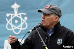 FILE - Washington Gov. Jay Inslee speaks during a rally at the beginning of the March For Science in Seattle, Washington, April 22, 2017.