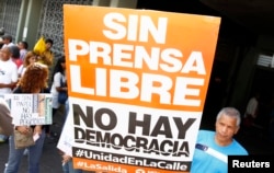 A sign reading "Without free press, there is no democracy", during a protest by newspaper workers and opposition parties in Caracas, Feb. 11, 2014.
