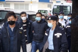 立场新闻署理总编辑林绍桐被港警拘捕。（2021年12月29日）
