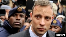 Olympic and Paralympic track star Oscar Pistorius leaves court after appearing for the 2013 killing of his girlfriend Reeva Steenkamp in the North Gauteng High Court in Pretoria, South Africa, June 14, 2016.