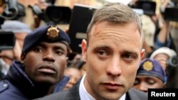 Olympic and Paralympic track star Oscar Pistorius leaves court after appearing for the 2013 killing of his girlfriend Reeva Steenkamp in the North Gauteng High Court in Pretoria, South Africa, June 14, 2016.