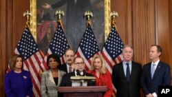 Democratic Party leaders of the US House of Representatives announce articles of impeachment against President Donald Trump, Tuesday, December 10, 2019. (AP Photo/Susan Walsh)