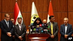 Najiha Abdul-Amir al-Shimari, head of Iraq's Martyrs Establishment speaks during a press conference, in Baghdad, March 20, 2018. Al-Shimari said the bodies of Indians abducted by the Islamic State group were found in a mass grave outside Mosul. 