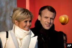 French President Emmanuel Macron and his wife Brigitte Macron visit the Forbidden City in Beijing, Jan. 9, 2018.