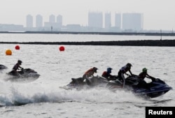 The jetski competition of the 2018 Asian Games, with a hazy Jakarta, Indonesia, in the background, Aug. 24, 2018