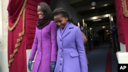 President Barack Obama's daughters Malia Obama, left, and Sasha Obama arrive on the West Front of the Capitol in Washington, Monday, Jan. 21, 2013, for the president's ceremonial swearing-in.