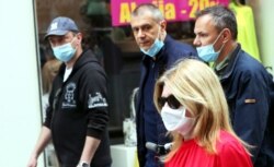 People wearing protective face masks amid the ongoing coronavirus COVID-19 pandemic in Sarajevo, 05 May 2020