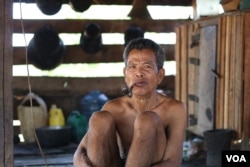 Kasol Met, 73, a Kachork ethnic villager, told VOA that he has lost one hectare of land to the Vietnamese rubber company. (Sun Narin/VOA Khmer)