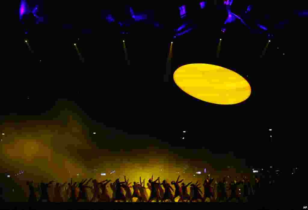 Performers dance during the Opening Ceremony at the 2012 Summer Olympics, July 27, 2012, in London.