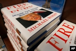 A stack of reserved "Fire and Fury" books by writer Michael Wolff sit on a shelf in a bookstore in Richmond, Va., Jan. 5, 2018.