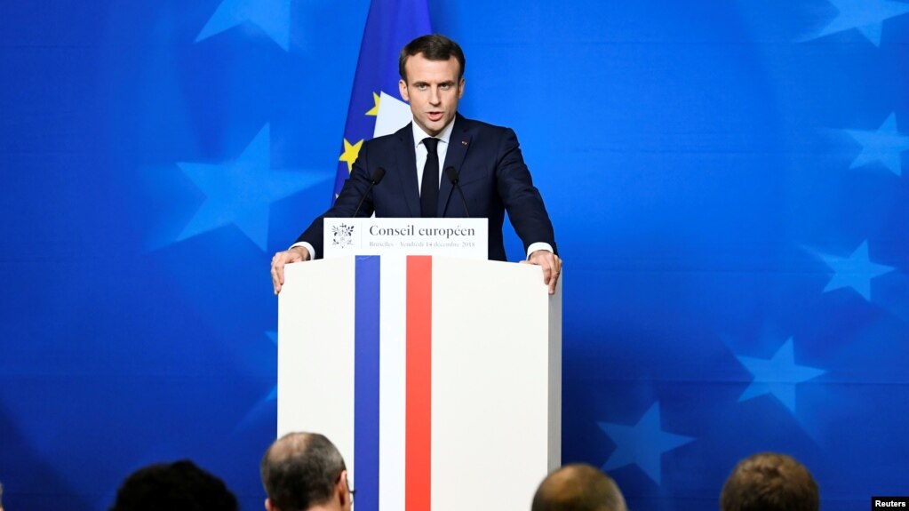 FILE - French President Emmanuel Macron attends a news conference after a European Union leaders summit in Brussels, Belgium, Dec. 14, 2018.