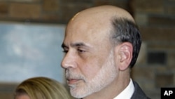 Federal Reserve chairman Ben Bernanke and his wife Anna arrive at an evening reception and dinner at the inaugural event of the annual Economic Policy Symposium at Jackson Hole in Moran, Wyoming, August 25, 2011