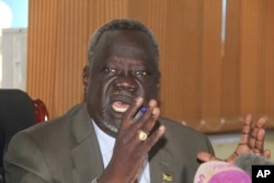 FILE - South African Minister of Health Dr. Riek Gai Kok speaks during a press conference in Juba, South Sudan, June 2, 2017.