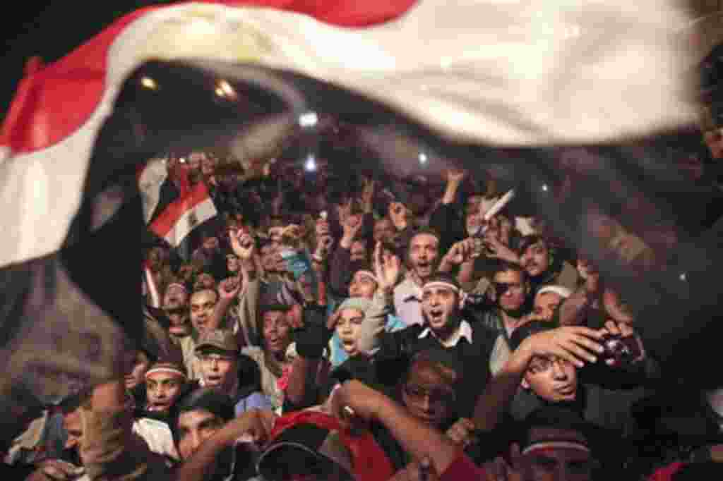 Egyptians celebrate the news of the resignation of President Hosni Mubarak, who handed control of the country to the military, Cairo, Egypt, Feb 11, 2011