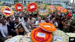 Local residents pay their respects to the victims of the attack at the Holey Artisan Bakery at a stadium in Dhaka, Bangladesh, July 4, 2016. 
