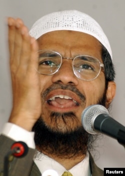 FILE - Islamic scholar Zakir Naik delivers a speech in Srinagar, in the Indian state of Jammu and Kashmir, Sept. 7, 2003.