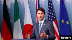 加拿大總理賈斯汀·杜魯多2018年6月9日在魁北克沙勒瓦市舉行的七國集團首腦會議的新聞發布會上。