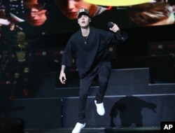 FILE - Justin Bieber performs during the Power 96.1 Jingle Ball at Philips Arena in Atlanta.
