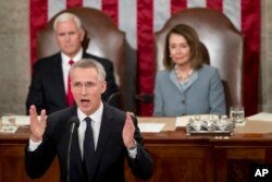 NATO Secretary General Jens Stoltenberg, accompanied by Vice President Mike Pence, left and House Speaker Nancy Pelosi of Calif., right, addresses Congress on Capitol Hill in Washington, April 3, 2019,