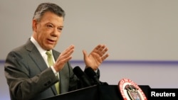 FILE - Colombia's President Juan Manuel Santos speaks during a press conference in Bogota, Colombia, Oct. 27, 2017. 