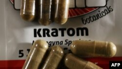 In this photo illustration, capsules of the herbal supplement kratom are seen in Miami, Fla., May 10, 2016.