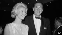 FILE - In this April 4, 1960, photo, Doris Day, a best actress of the year nominee for her role in "Pillow Talk," and her producer husband Marty Melcher, arrive for the annual Academy Award presentations at the Pantages Theater in Los Angeles.