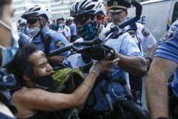 Philadelphia police confront protesters during the Justice for George Floyd Philadelphia Protest on Saturday, May 30, 2020.