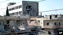  Handout photo released by the Syrian opposition Shaam News Network on April 25, 2012, shows a shop destroyed during a Syrian government offensive in the city of Duma.
