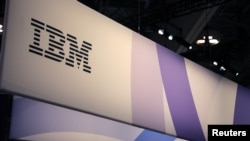 FILE - The IBM logo is seen at the SIBOS banking and financial conference in Toronto, Ontario, Canada, Oct. 19, 2017. 
