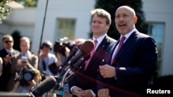 Lloyd Blankfein, Chairman and CEO of The Goldman Sachs Group, and Brian Moynihan CEO of Bank of America, speak to the media after a meeting by the Financial Services Forum with U.S. President Barack Obama at the White House, Oct. 2, 2013. 