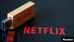 FILE - USB key with the logo of Netflix, the American provider of on-demand Internet streaming media, is seen in this illustration photo, in Paris, France, Sept. 15, 2014.