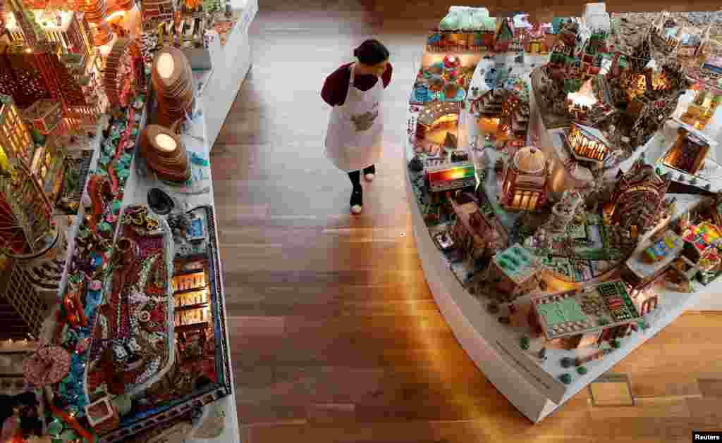 A staff member checks the Museum of Architecture's Gingerbread City at the V&A Museum, in London, Britain, Dec. 5, 2018.