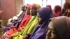 Des écolières nigérianes, ex-otages de Boko Haram, en visite au palais présidentiel d'Abuja, le 23 mars 2018. (AFP PHOTO / PHILIP OJISUA)