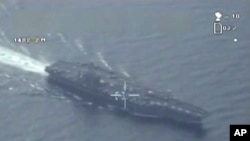 This still image made from video broadcast on Iranian state television, Jan. 29, 2016, shows what purports to be drone footage of a U.S. aircraft carrier.