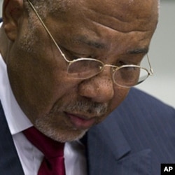 Former Liberian President Charles Taylor looks down as he waits for the start of a hearing to deliver verdict in the court room of the Special Court for Sierra Leone in Leidschendam, near The Hague, Netherlands, April 26, 2012.
