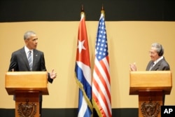 U.S. President Barack Obama, left, speaks next to Cuba's President Raul Castro, during a joint statement in Havana, Cuba, March 21, 2016.