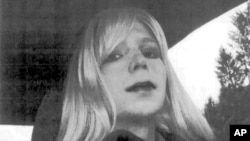 FILE - In this undated file photo provided by the U.S. Army, Pfc. Chelsea Manning poses for a photo wearing a wig and lipstick.
