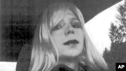 FILE - In this undated file photo provided by the U.S. Army, Pfc. Chelsea Manning poses for a photo wearing a wig and lipstick. Attorneys for the transgender soldier imprisoned in Kansas for sending classified information to the anti-secrecy website WikiLeaks.