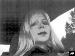 FILE - In this undated file photo provided by the U.S. Army, Pfc. Chelsea Manning poses for a photo wearing a wig and lipstick. Attorneys for the transgender soldier imprisoned in Kansas for sending classified information to the anti-secrecy website WikiLeaks.