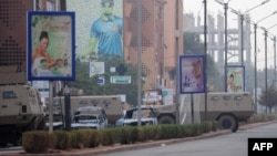 Burnt vehicles are seen in the surroundings of the Splendid hotel following an attack by Al-Qaeda linked gunmen on Jan. 16, 2016 in Ouagadougou. 