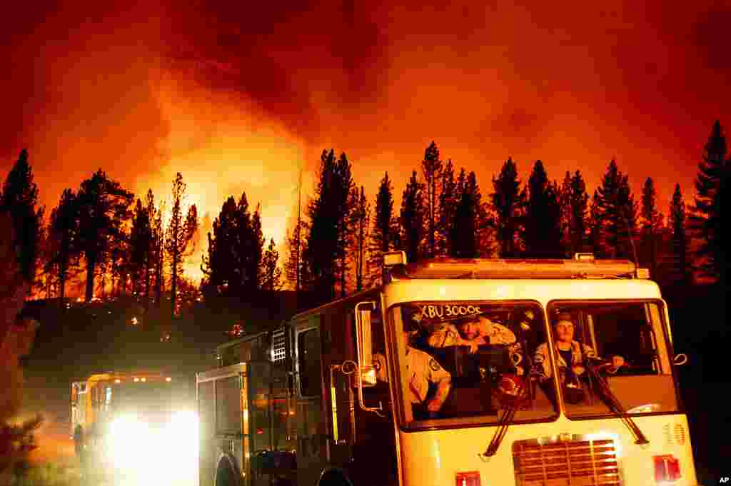 Firefighters arrive at Frenchman Lake to battle the Sugar Fire, part of the Beckwourth Complex Fire, burning in Plumas National Forest, California, July 8, 2021.